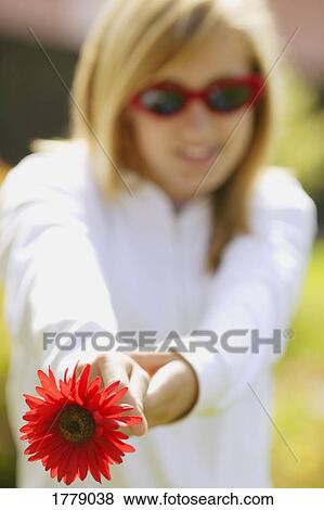 Stock Photo - Showing off flower. Fotosearch