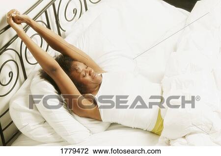 Stock Image - Sleeping in bed. Fotosearch