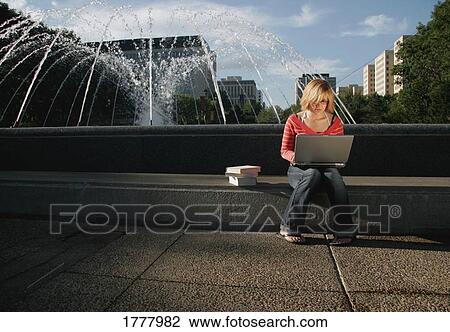 Student works on lap top computer View Large Photo Image Stock Image - Student works on lap top computer. Fotosearch