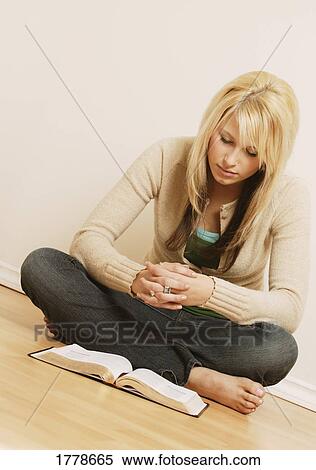 Studying a book View Large Photo Image Stock Photography - Studying a book. Fotosearch