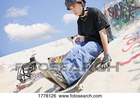 Teen rides skateboard View Large Photo Image Stock Photograph - Teen rides skateboard. Fotosearch