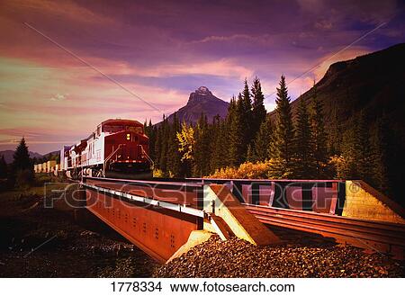 Picture - Train going over a bridge. Fotosearch