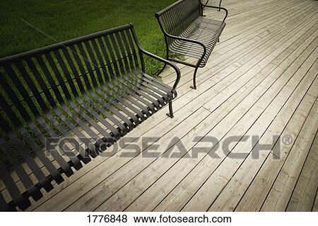 Two metal park benches View Large Photo Image Stock Photo - Two metal park benches. Fotosearch