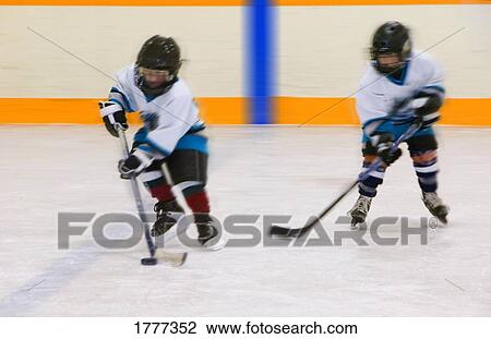 Stock Image - Two young hockey players. Fotosearch