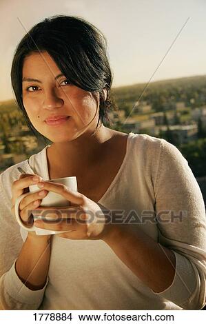 Woman drinks coffee View Large Photo Image Picture - Woman drinks coffee. Fotosearch