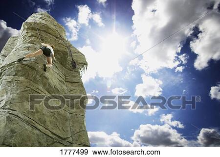 Woman rock climbing View Large Photo Image Stock Photo - Woman rock climbing. Fotosearch