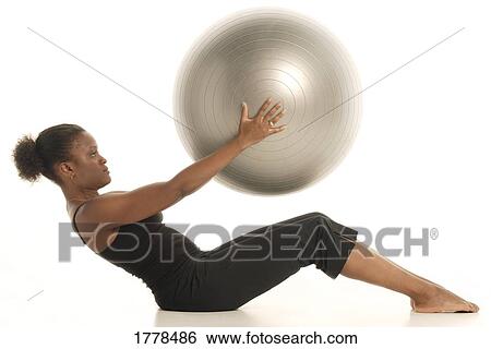 Woman with exercise ball View Large Photo Image Stock Photograph - Woman with exercise ball. Fotosearch