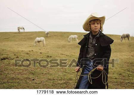 Stock Photo - Young boy with lasso. Fotosearch