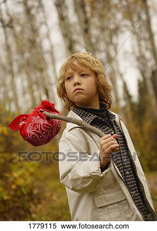 Stock Photography - Young boy with pack walking. Fotosearch