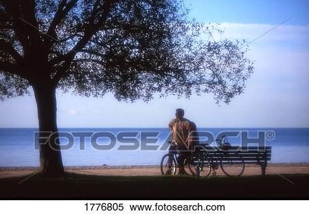 Young Couple Bicycles on the Boardwalk View Large Photo Image Stock Photography - Young Couple Bicycles on the Boardwalk. Fotosearch