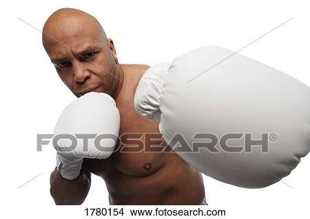 Picture - A boxer punches. Fotosearch