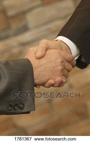 A handshake View Large Photo Image Stock Photo - A handshake. Fotosearch