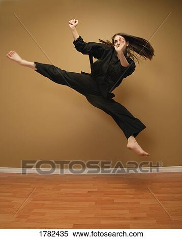 A jump kick View Large Photo Image Stock Photography - A jump kick. Fotosearch