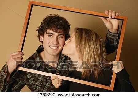 A kiss on the cheek View Large Photo Image Stock Image - A kiss on the cheek. Fotosearch