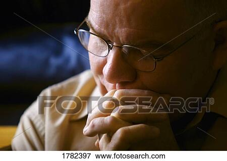 Stock Photo - A man deep in thought. Fotosearch