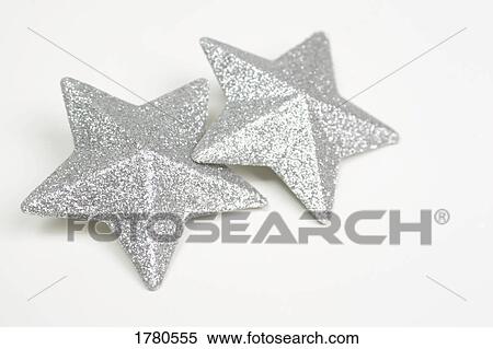 A pair of silver stars View Large Photo Image Stock Photography - A pair of silver stars. Fotosearch