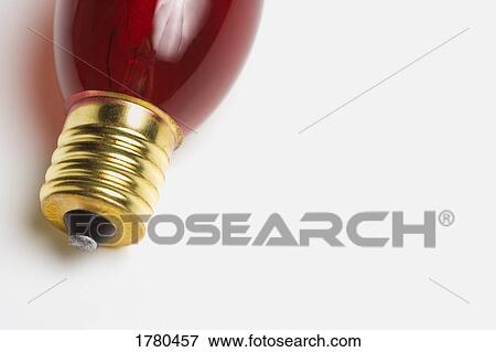 Stock Photo - A red light bulb. Fotosearch