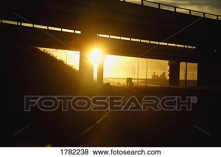 Stock Photo - A road with a bridge. Fotosearch