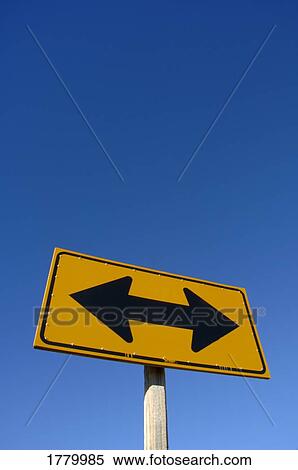 A sign with two arrows View Large Photo Image Stock Photography - A sign with two arrows. Fotosearch
