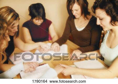 A small group prays together View Large Photo Image Picture - A small group prays together. Fotosearch