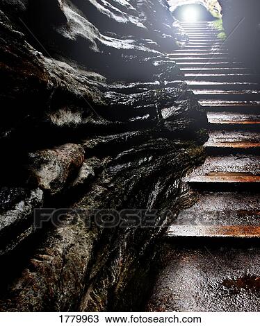 A staircase through a cave View Large Photo Image Stock Image - A staircase through a cave. Fotosearch