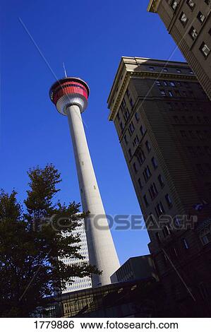 Stock Photograph - A tall tower in downtown city. Fotosearch