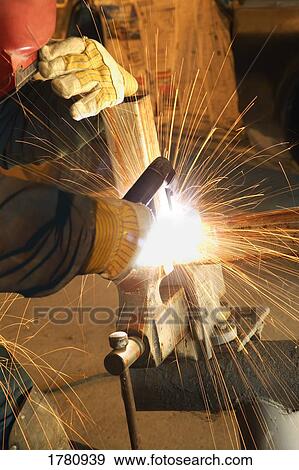 A welder in action View Large Photo Image Stock Photo - A welder in action. Fotosearch