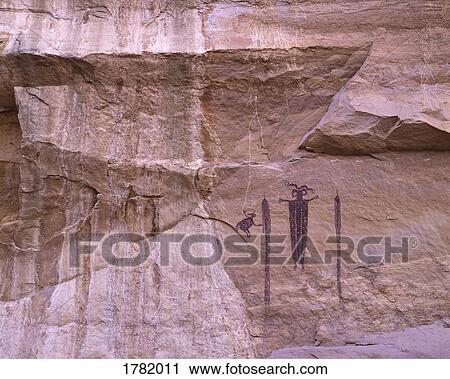Stock Image - Ancient pictographs on a canyon wall. Fotosearch