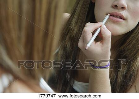 Applying lip liner View Large Photo Image Stock Photo - Applying lip liner. Fotosearch