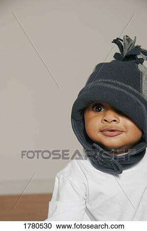 Stock Image - Baby wearing toque. Fotosearch