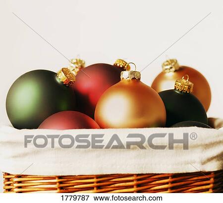 Stock Photo - Basket full of Christmas decorations. Fotosearch
