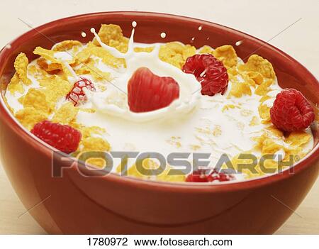 Stock Image - Bowl of cereal with raspberries. Fotosearch