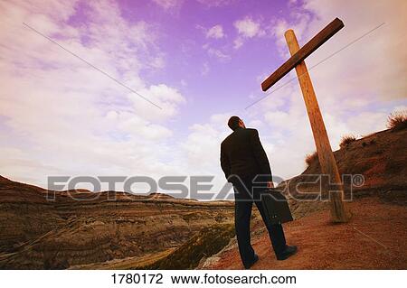 Stock Image - Businessman comes to cross. Fotosearch