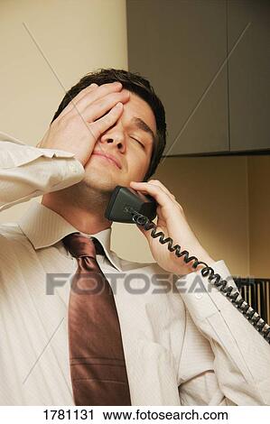 Stock Image - Businessman feels stress. Fotosearch