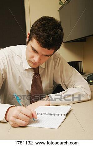 Businessman writes notes View Large Photo Image Stock Image - Businessman writes notes. Fotosearch
