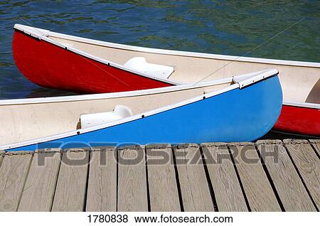 Canoes at dock View Large Photo Image Stock Photo - Canoes at dock. Fotosearch