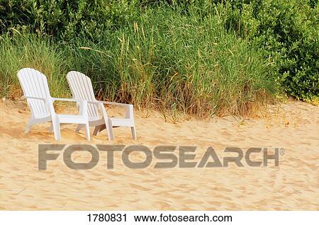 Stock Image - Chairs on beach. Fotosearch