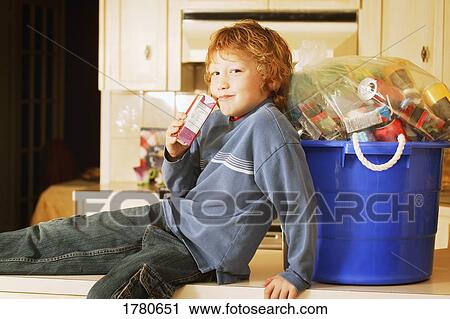 Child drinks juice box View Large Photo Image Stock Image - Child drinks juice box. Fotosearch