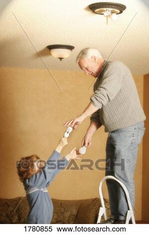 Child helping grandparent View Large Photo Image Stock Photography - Child helping grandparent. Fotosearch