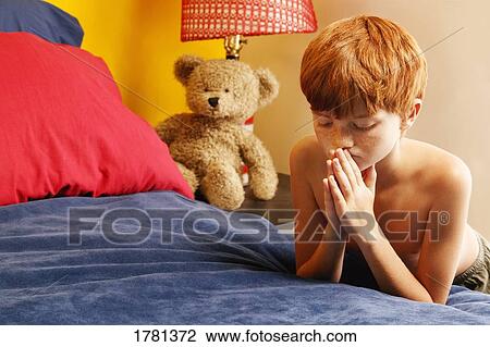 Stock Image - Child prays. Fotosearch