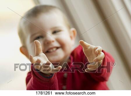 Stock Image - Child reaching out. Fotosearch