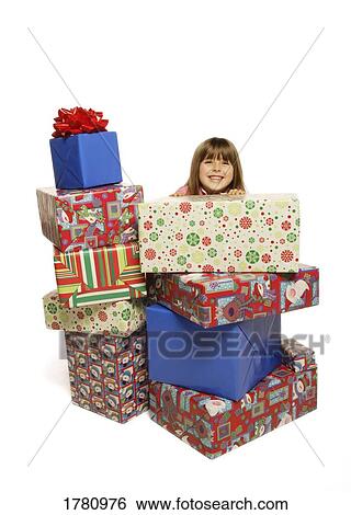 Child with Christmas presents View Large Photo Image Stock Photograph - Child with Christmas presents. Fotosearch