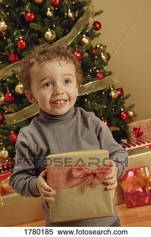 Child with present View Large Photo Image Stock Photography - Child with present. Fotosearch