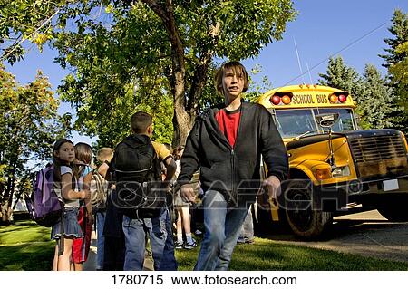 Stock Photography - Children and school bus. Fotosearch