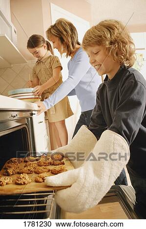 Children helping to bake cookies View Large Photo Image Stock Image - Children helping to bake cookies. Fotosearch