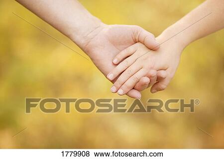 Stock Photo - Children holding hands. Fotosearch