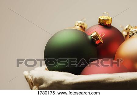 Christmas decorations in a basket View Large Photo Image Stock Photography - Christmas decorations in a basket. Fotosearch