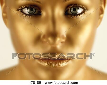 Closeup of a golden face View Large Photo Image Stock Image - Closeup of a golden face. Fotosearch