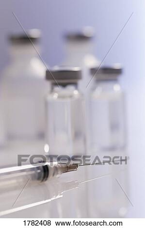 Closeup of a needle with vials View Large Photo Image Stock Photo - Closeup of a needle with vials. Fotosearch
