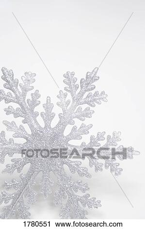 Stock Image - Closeup of a snow flake. Fotosearch